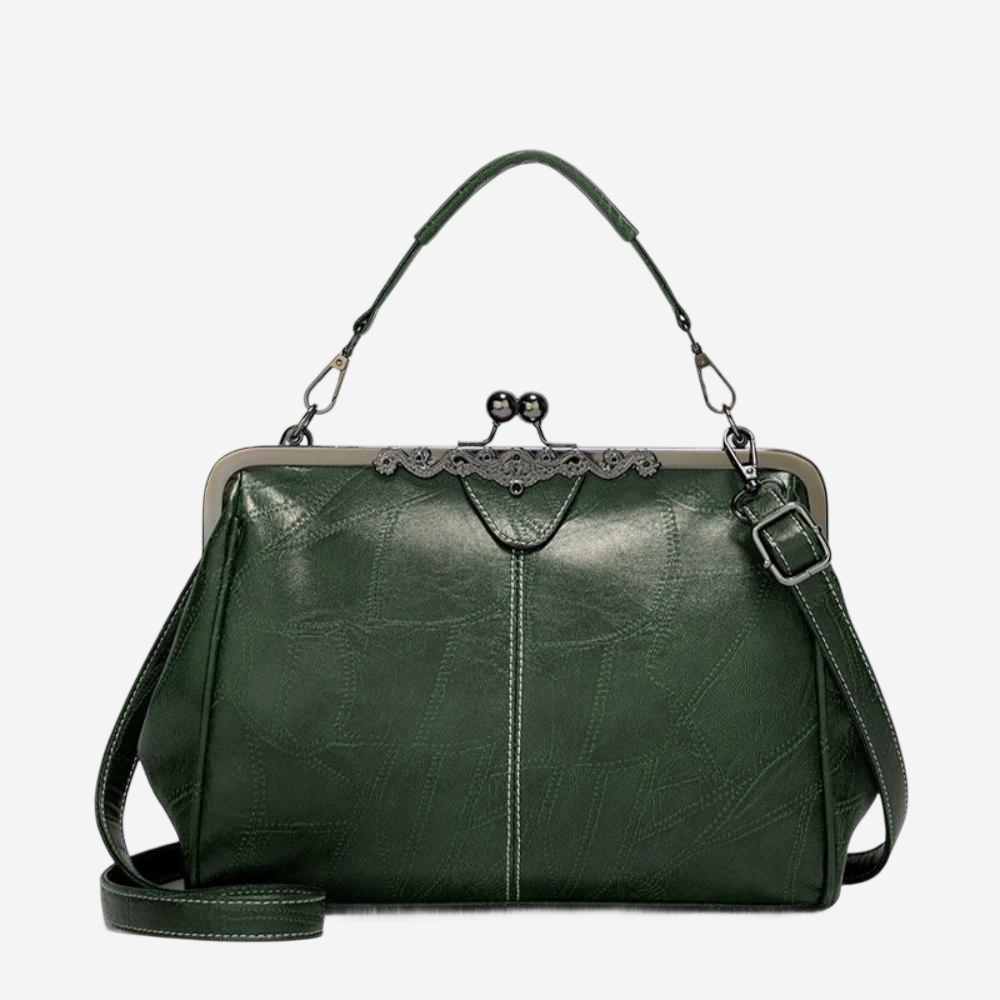 A green leather handbag with a metal clasp and handle.