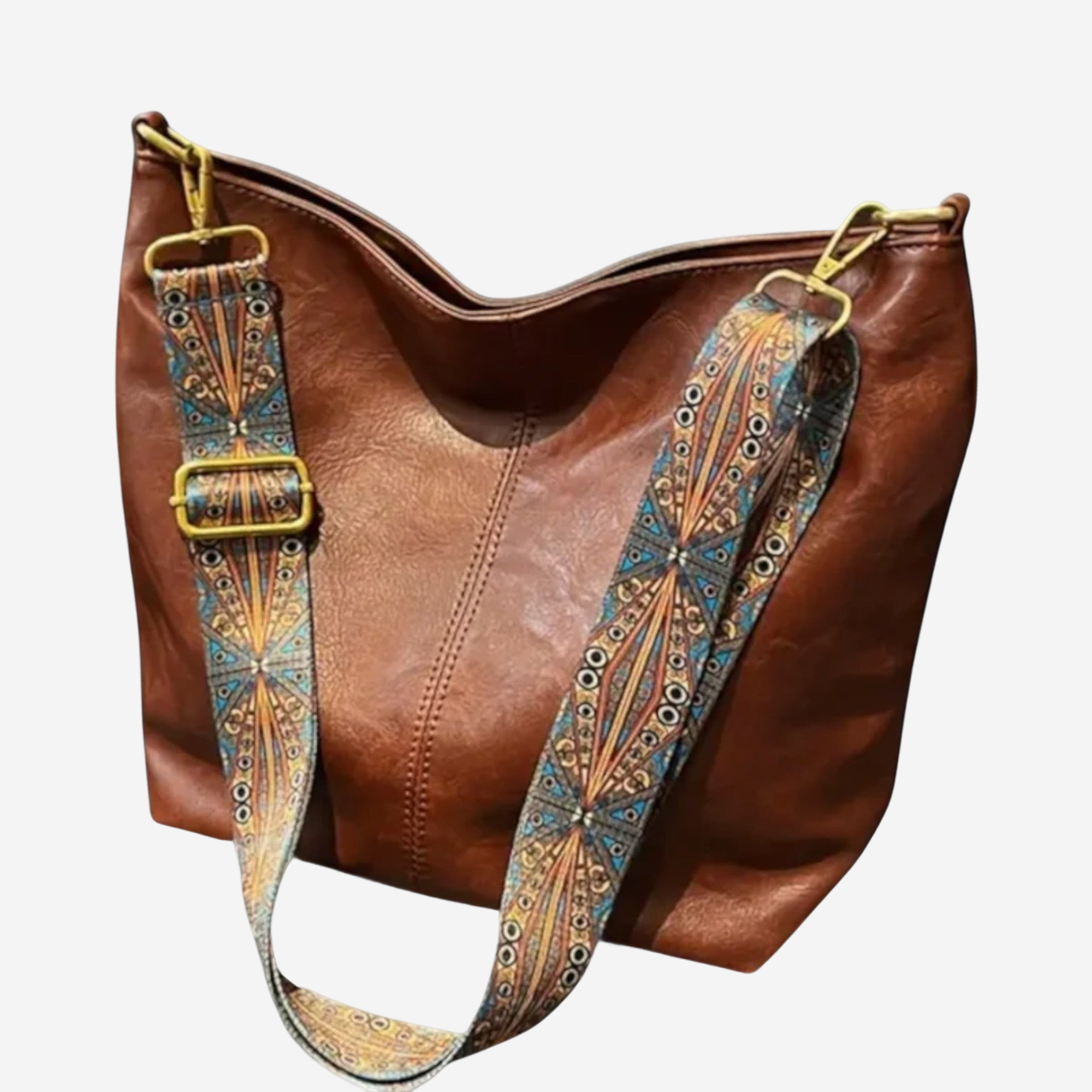 A brown leather handbag with a patterned strap and gold hardware.