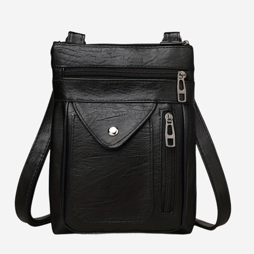 A black leather crossbody bag with multiple zippers and pockets.