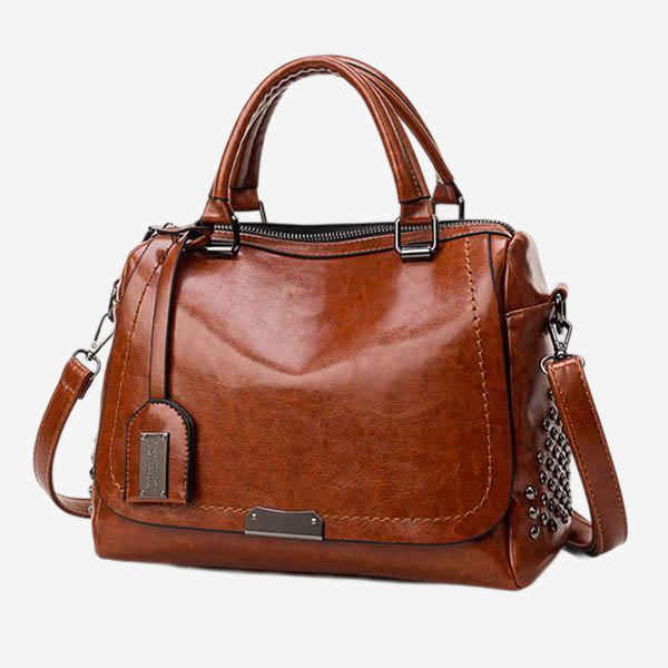 A brown leather handbag with multiple compartments and zippers.
