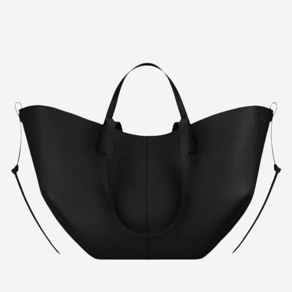 A large black tote bag with a curved handle and two straps.