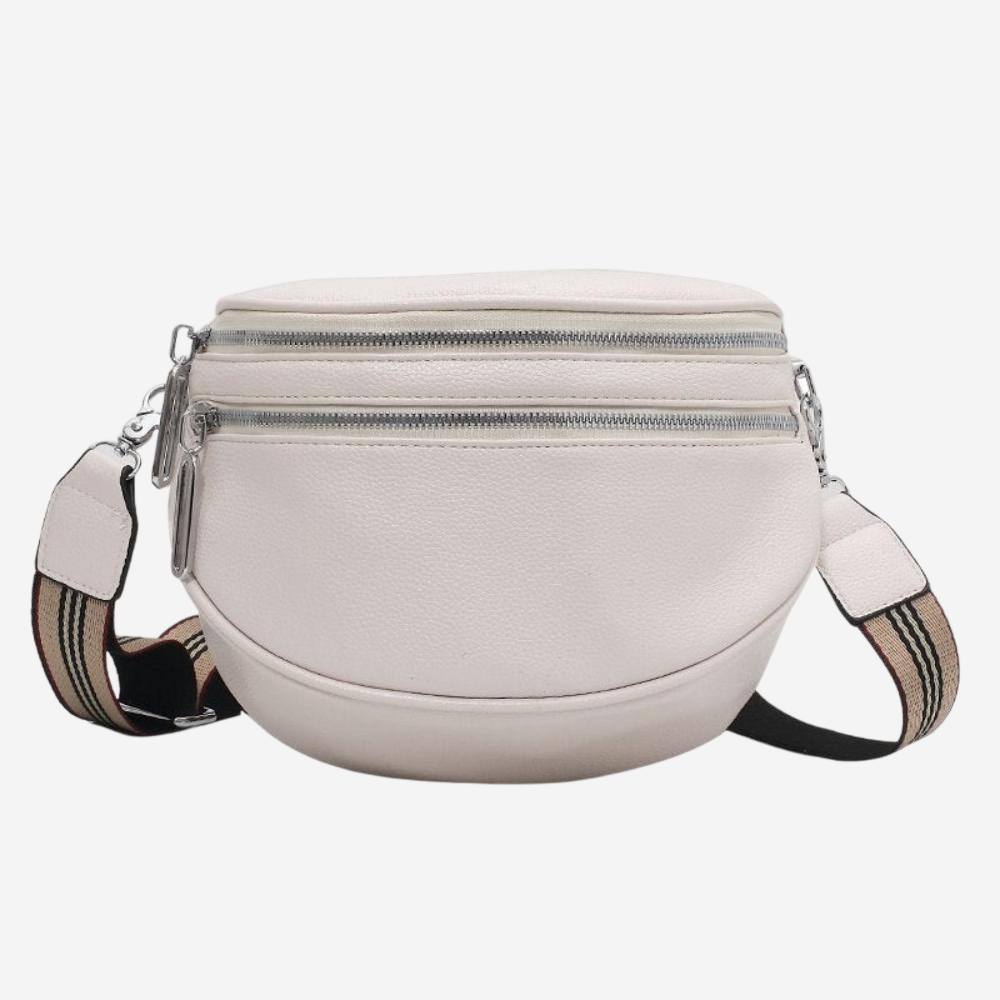A white leather crossbody bag with multiple zippers and a striped strap.