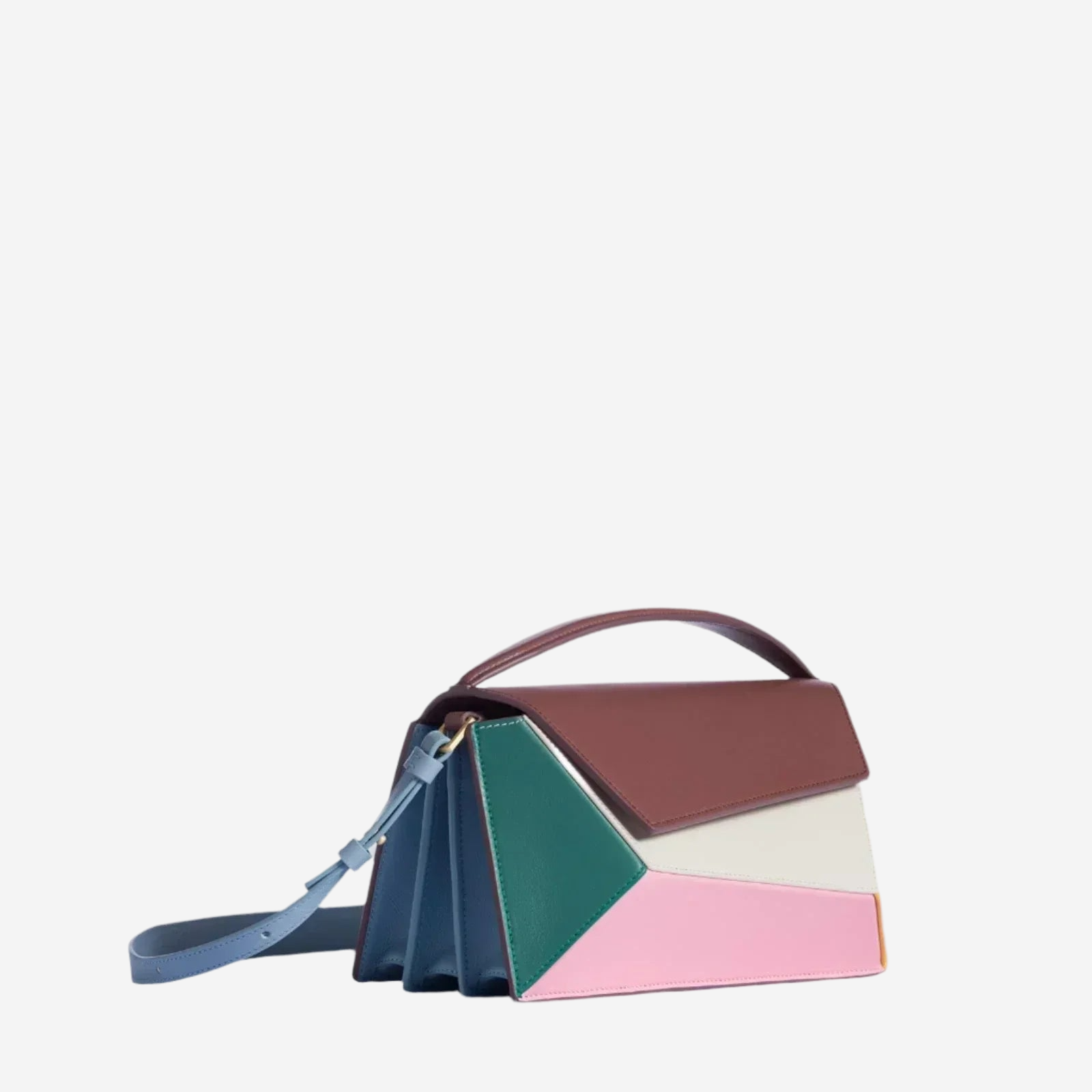 A colorful handbag with a geometric pattern in shades of pink, green, blue, and brown.
