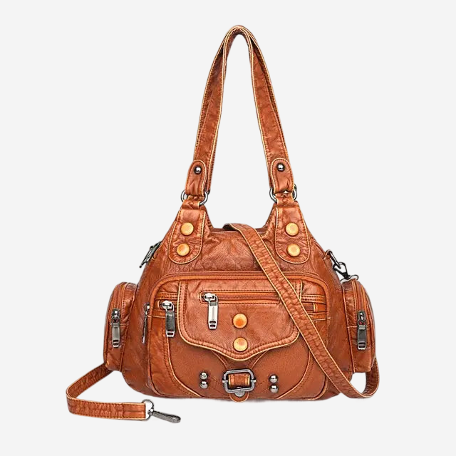 A brown leather handbag with multiple pockets and zippers, featuring a long strap and a metal clasp.
