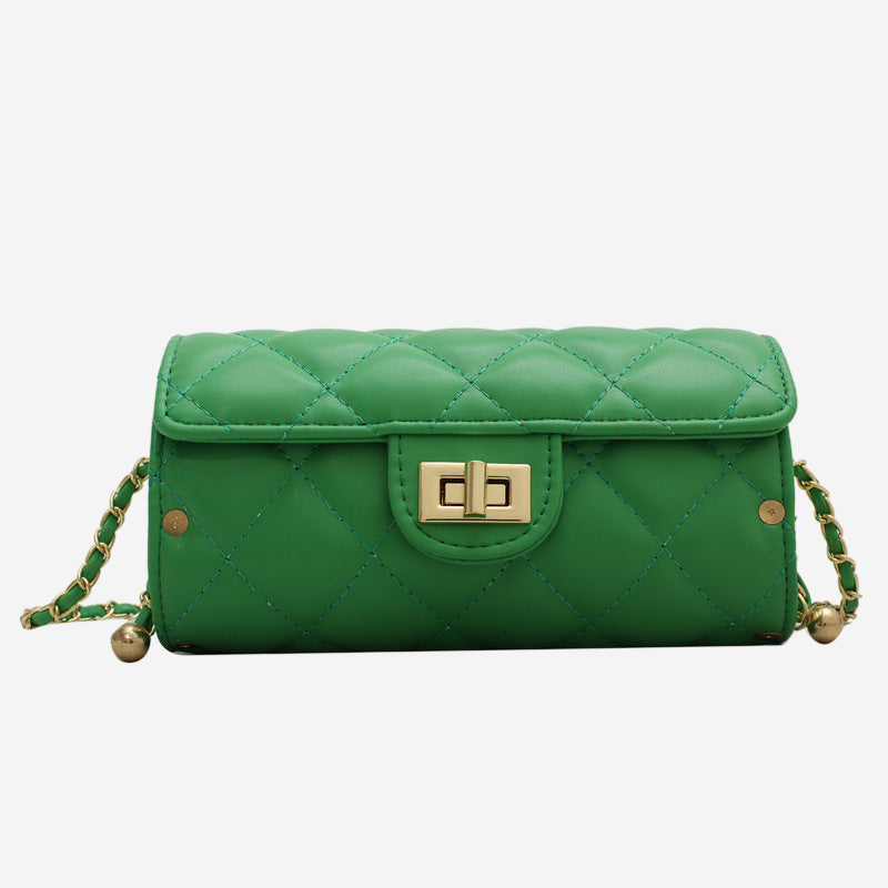 A green quilted handbag with a gold lock closure.