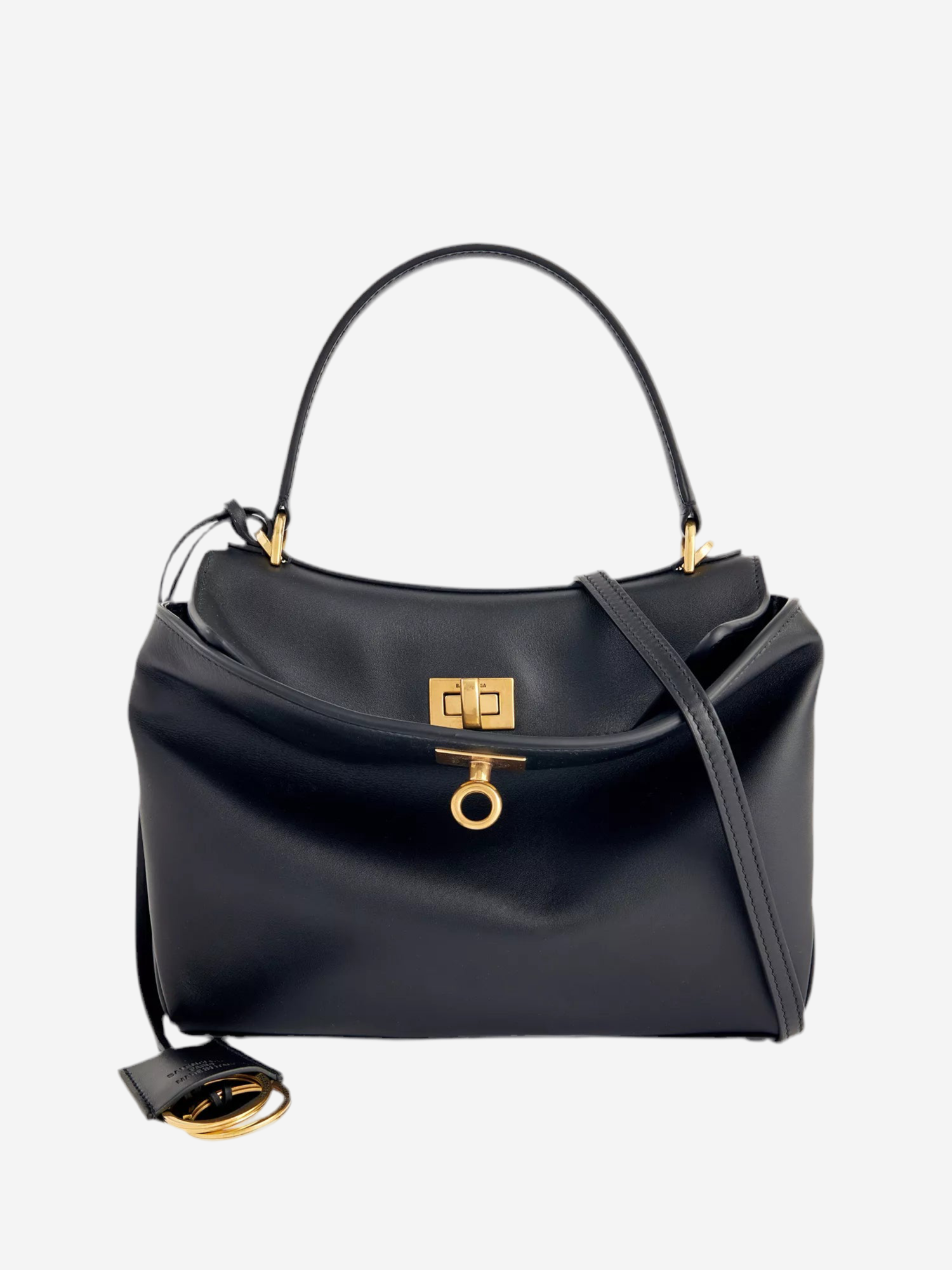 A black leather handbag with a gold lock and handle.