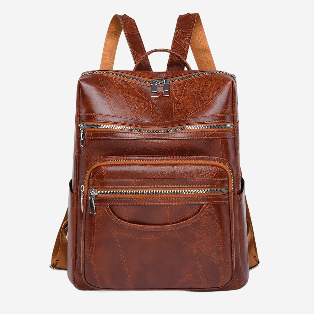 A brown leather backpack with multiple zippers and pockets.