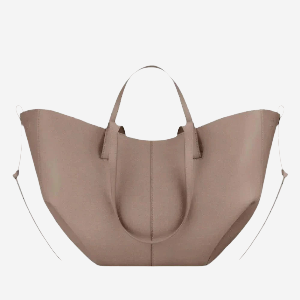 A large, light brown leather tote bag with a curved handle and two handles on either side.