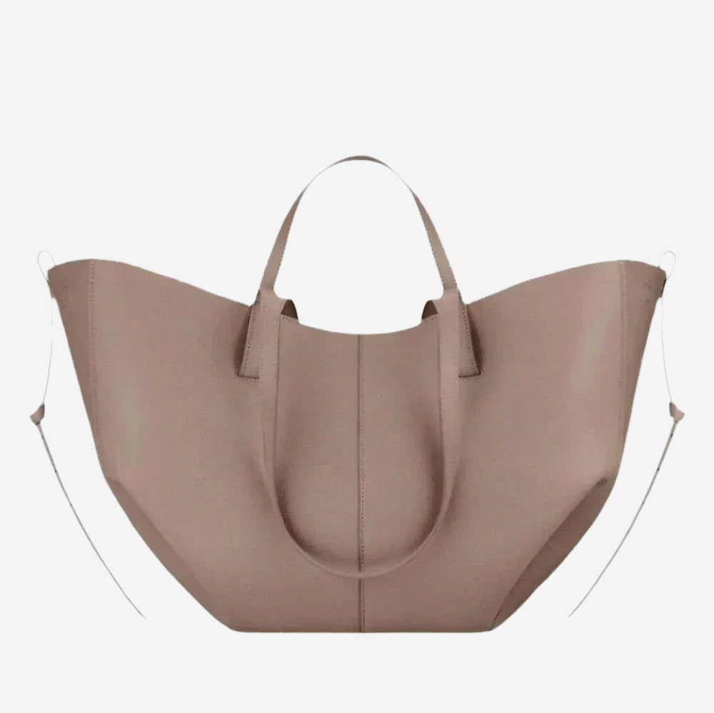 A large, light brown leather tote bag with a curved handle and two handles on either side.