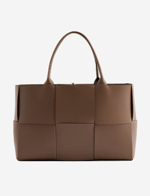 A large brown leather tote bag with a distinctive woven pattern.