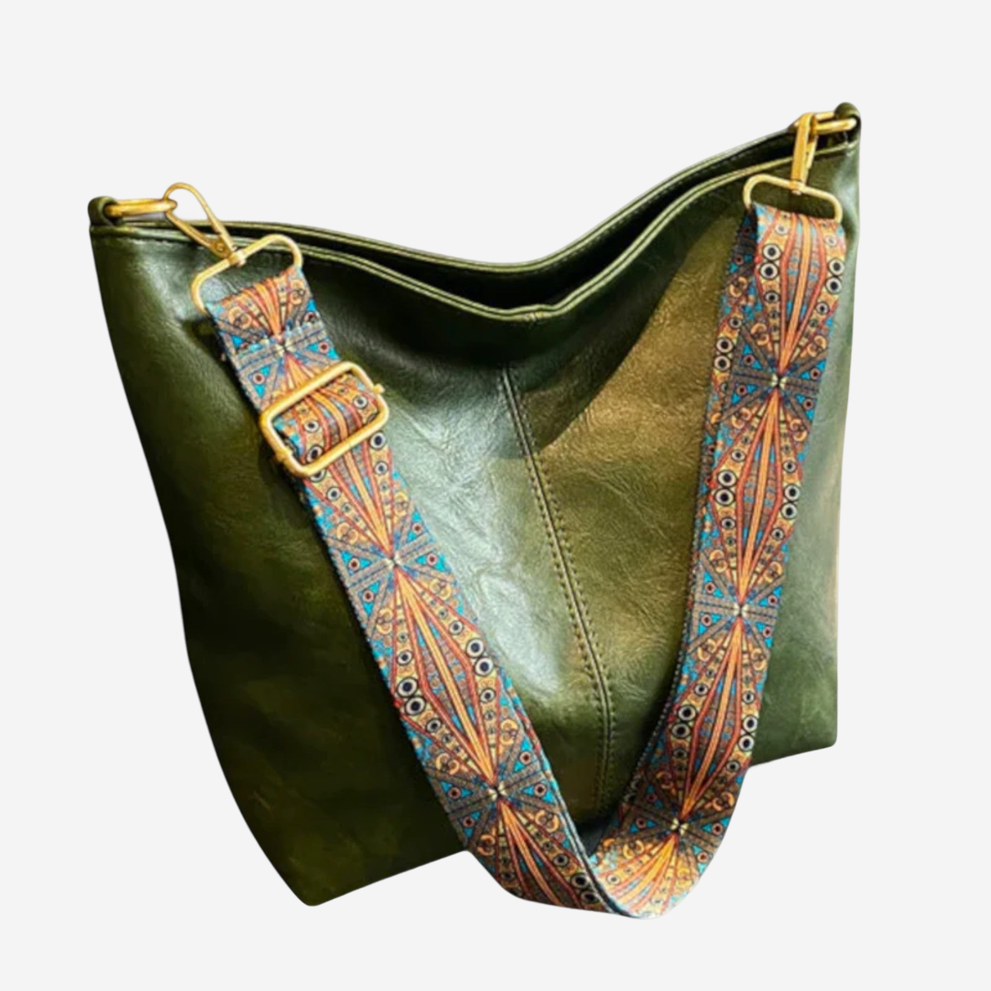 A green leather handbag with a patterned strap.