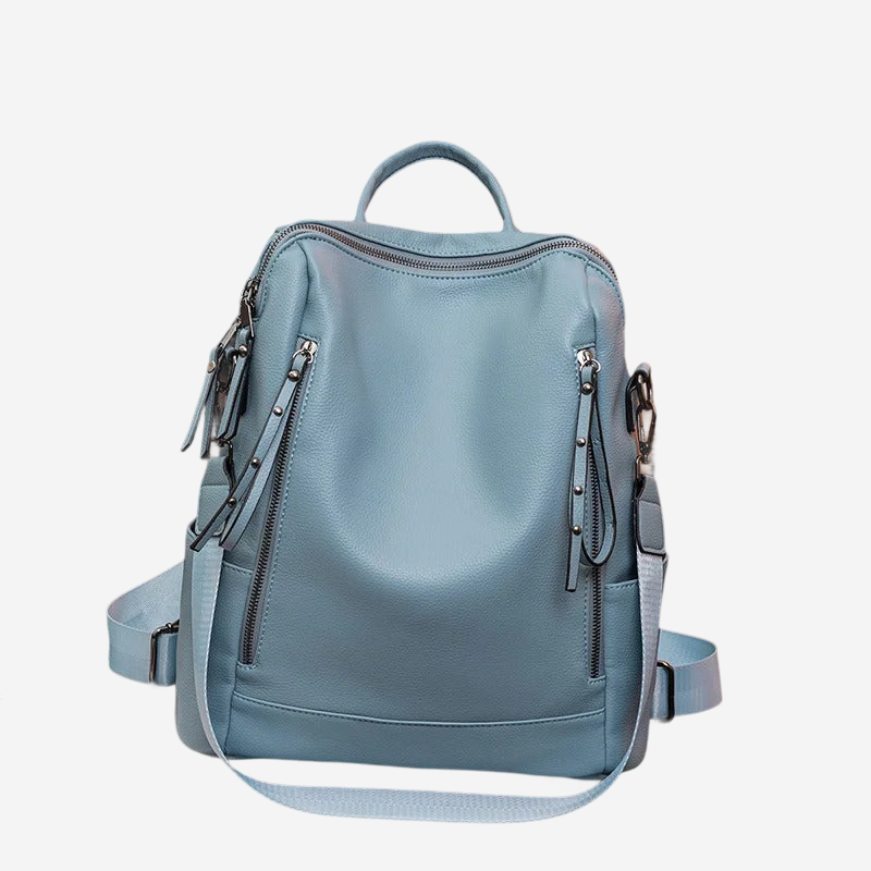 A light blue backpack with multiple zippers and a handle, designed for carrying various items.