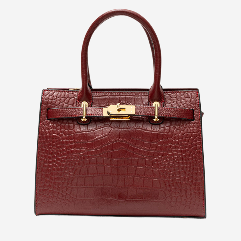 A burgundy leather handbag with a crocodile skin texture and gold hardware.