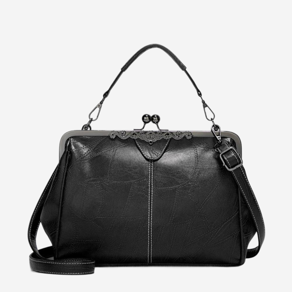 A black leather handbag with a lace-like closure and a black strap.