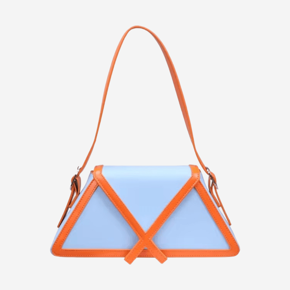 A blue handbag with an orange strap and a triangular shape.