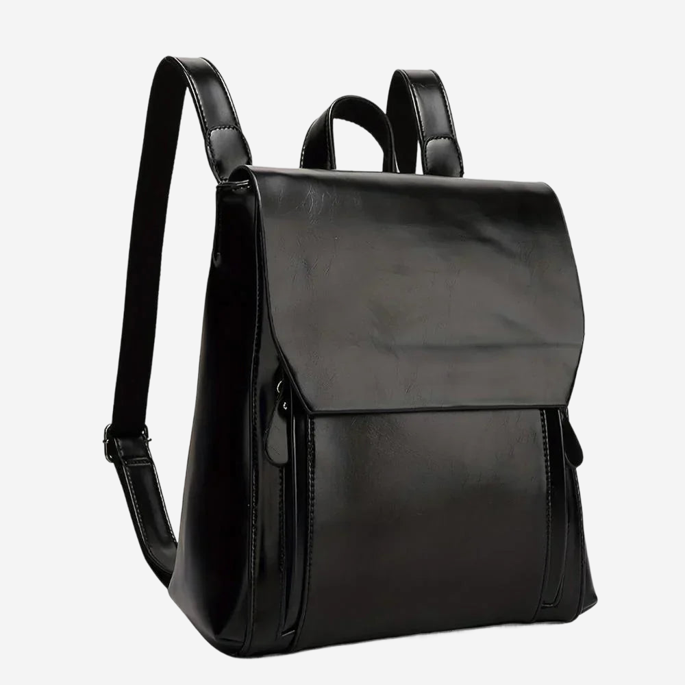 A black leather backpack with a flap closure and two straps.