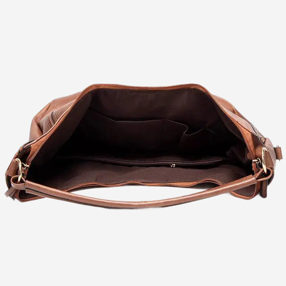 An open brown leather handbag with a brown interior and a brown leather handle.