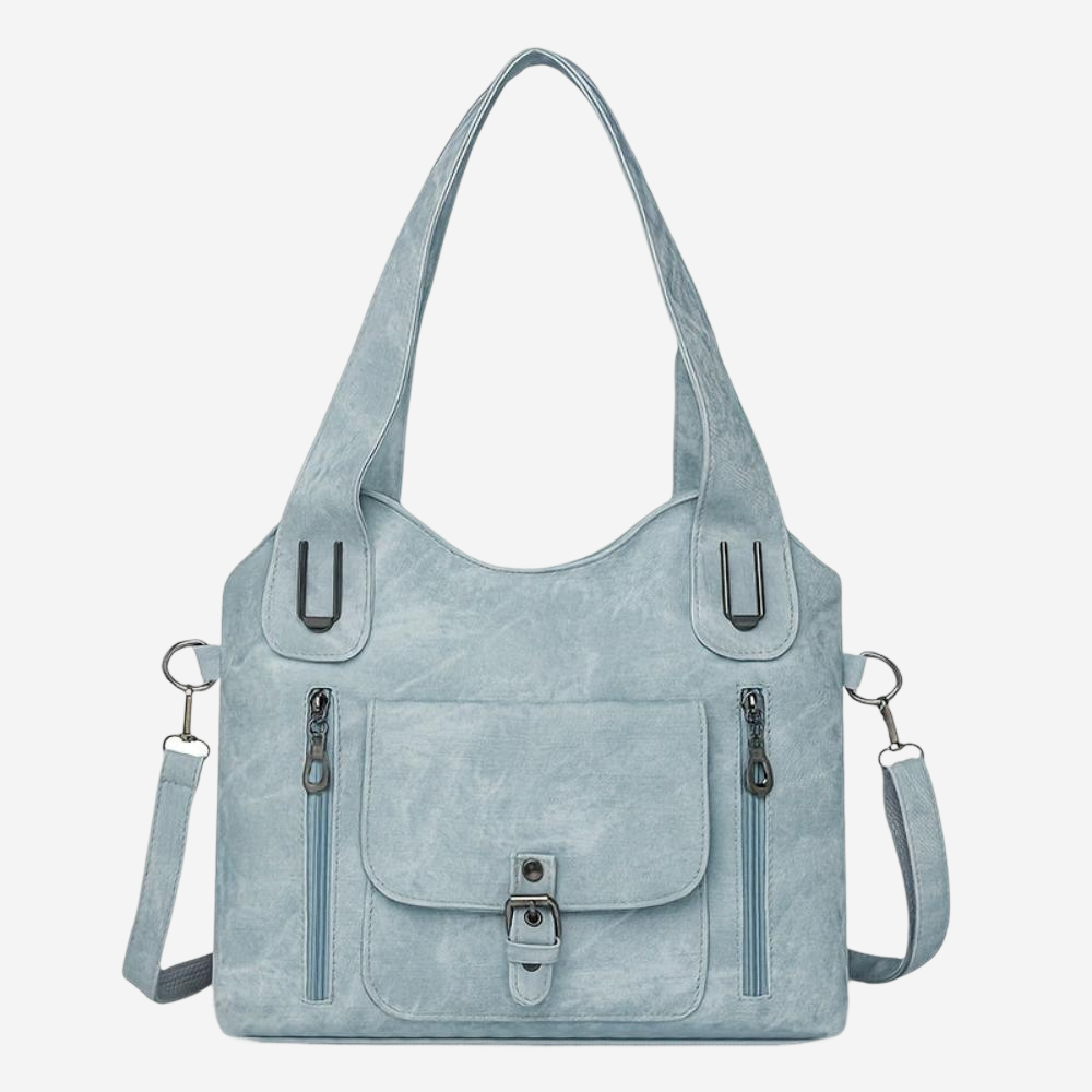A light blue tote bag with multiple pockets and zippers, featuring a curved handle and two metal clasps.