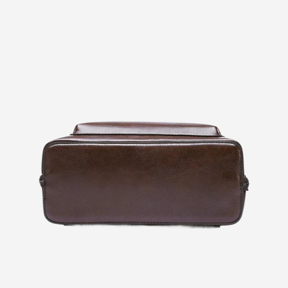 A brown leather bag with a flap closure and a top handle.