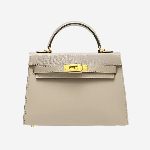 A tan leather handbag with a gold lock and handle.