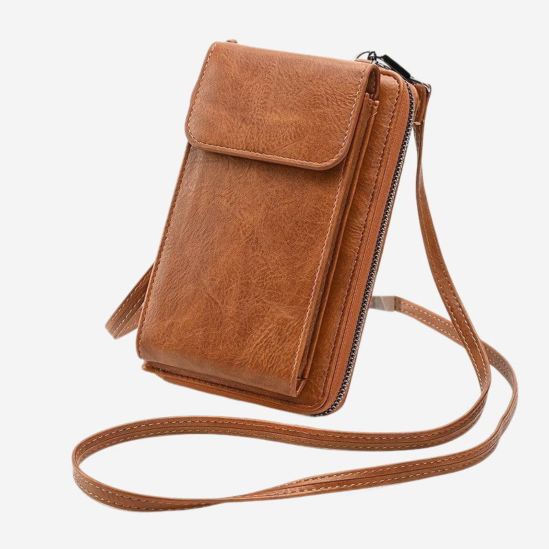 A brown leather crossbody bag with a zipper closure and a long strap.