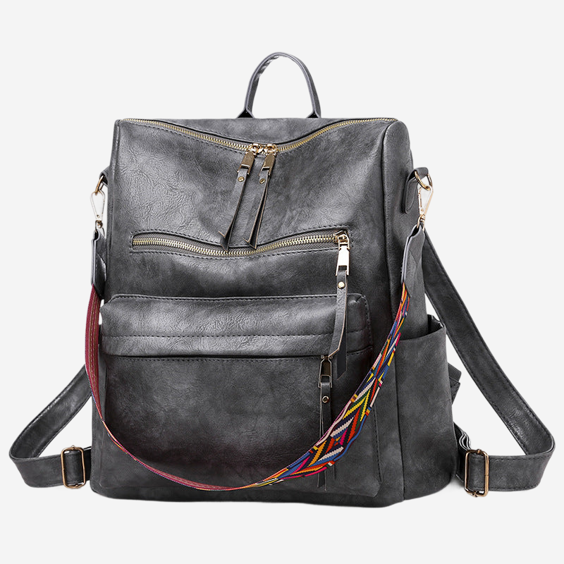 A black leather backpack with multiple zippers and a colorful strap.