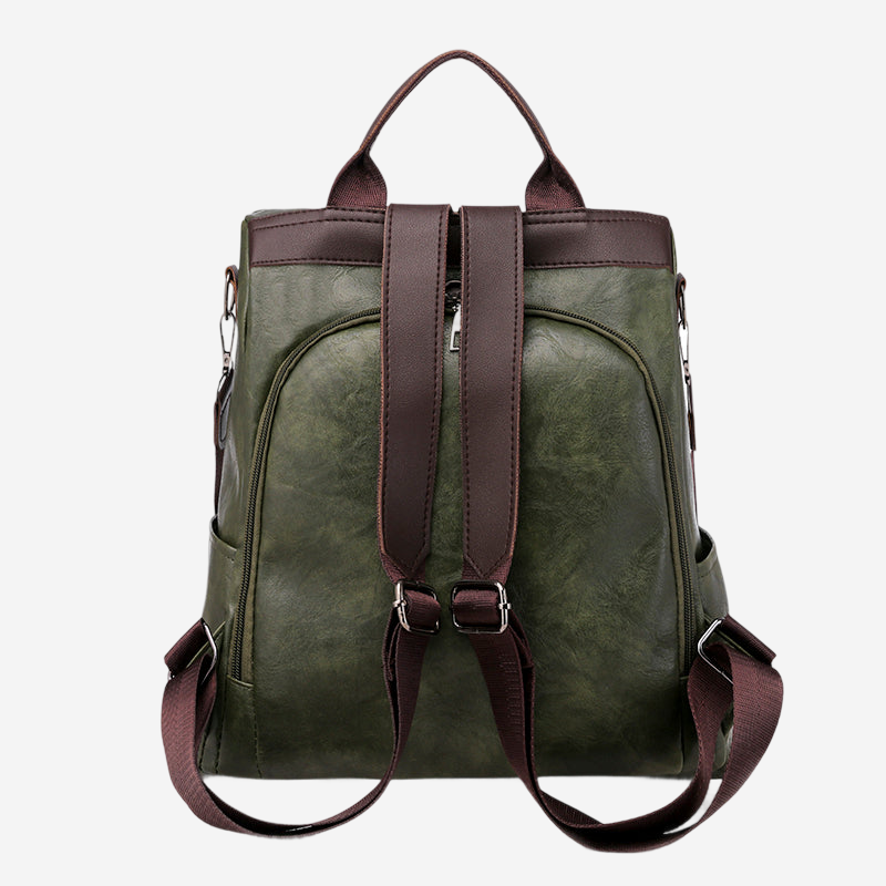 A green leather backpack with brown straps and buckles.
