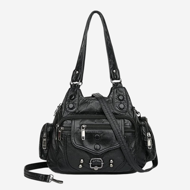 A black leather handbag with multiple pockets and zippers, featuring a long strap and a metallic clasp.