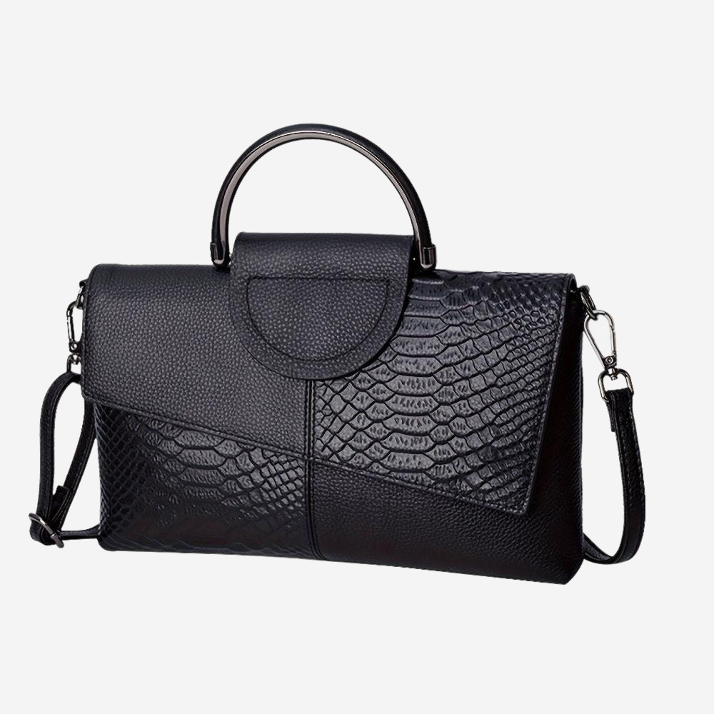 A black leather handbag with a unique pattern of snakeskin texture.