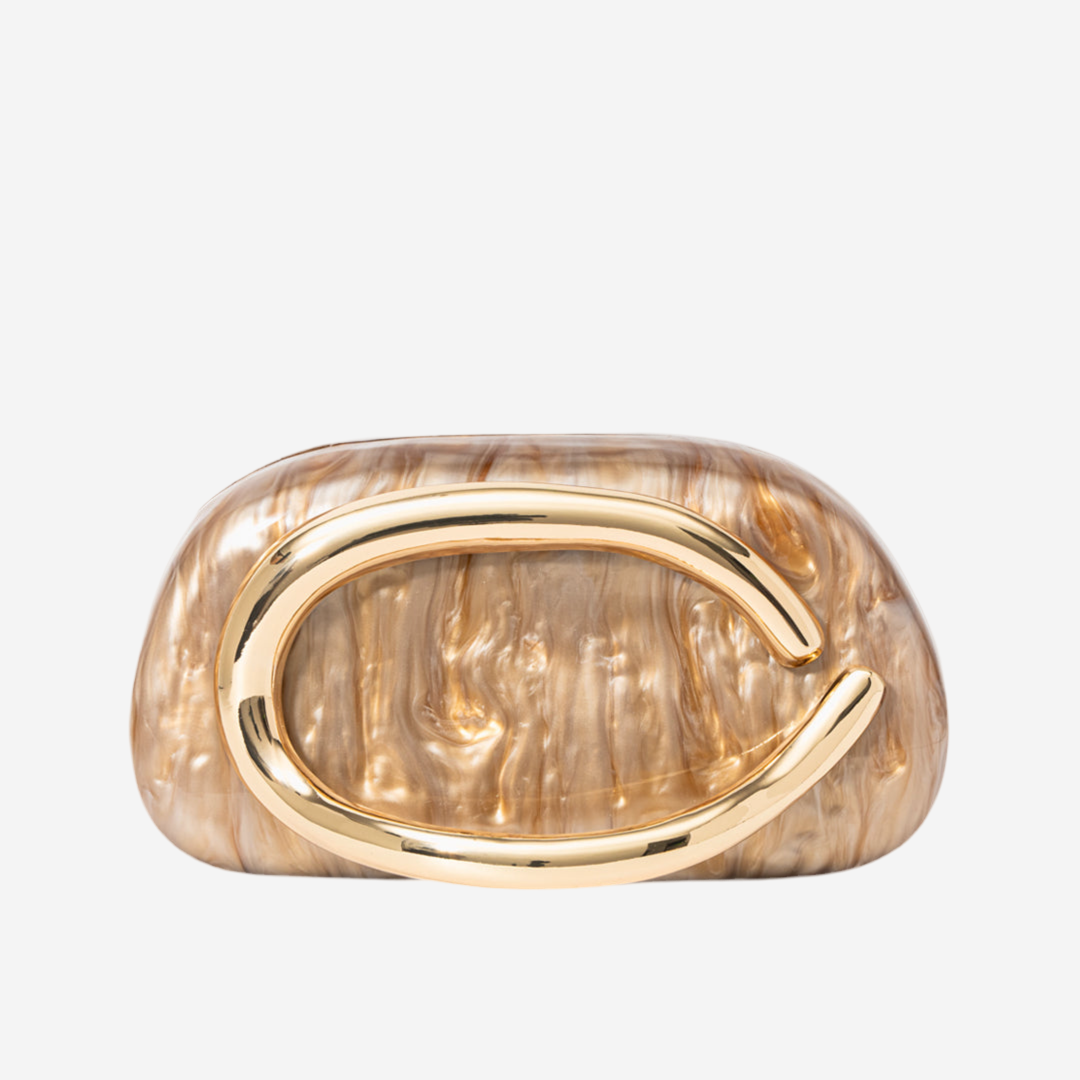 A gold-colored, textured bag with a curved handle.