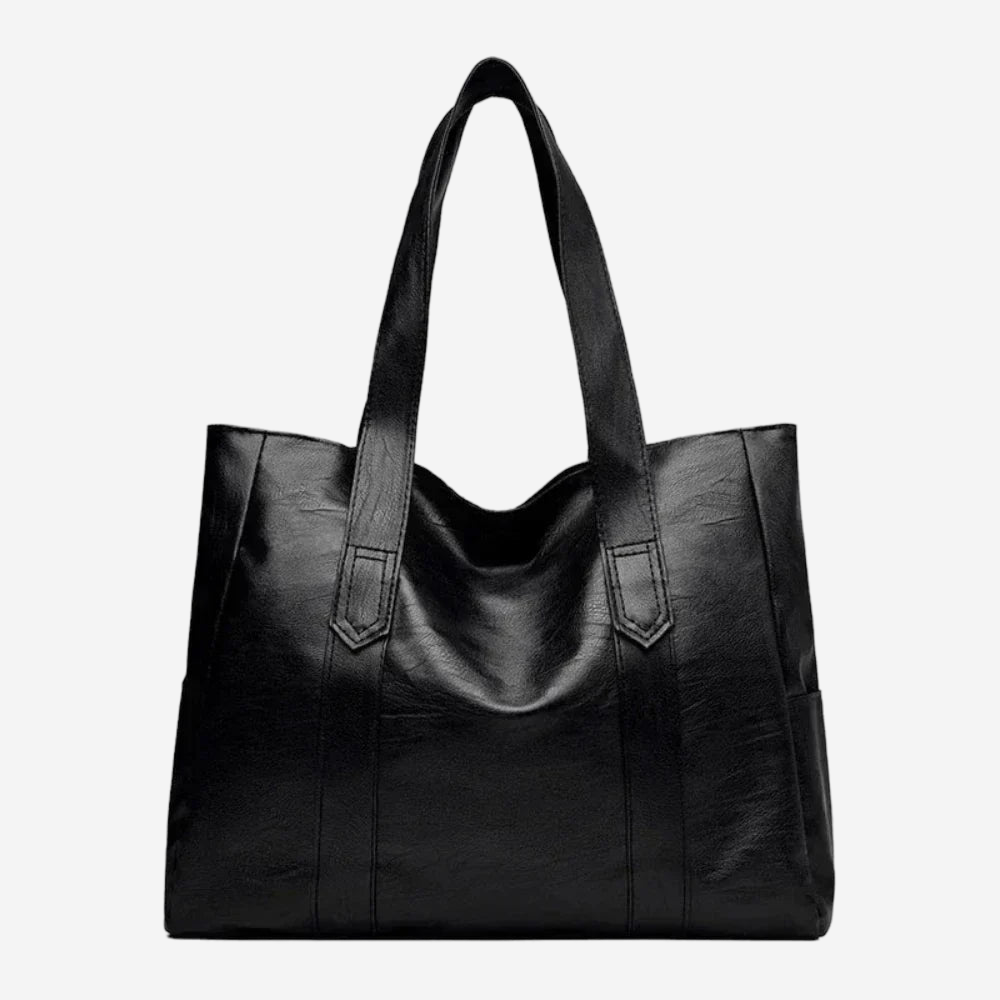 A large black leather tote bag with a curved handle and two shoulder straps.