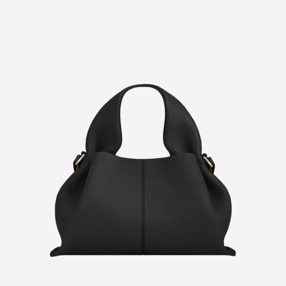 A black leather handbag with a curved handle and gold hardware.