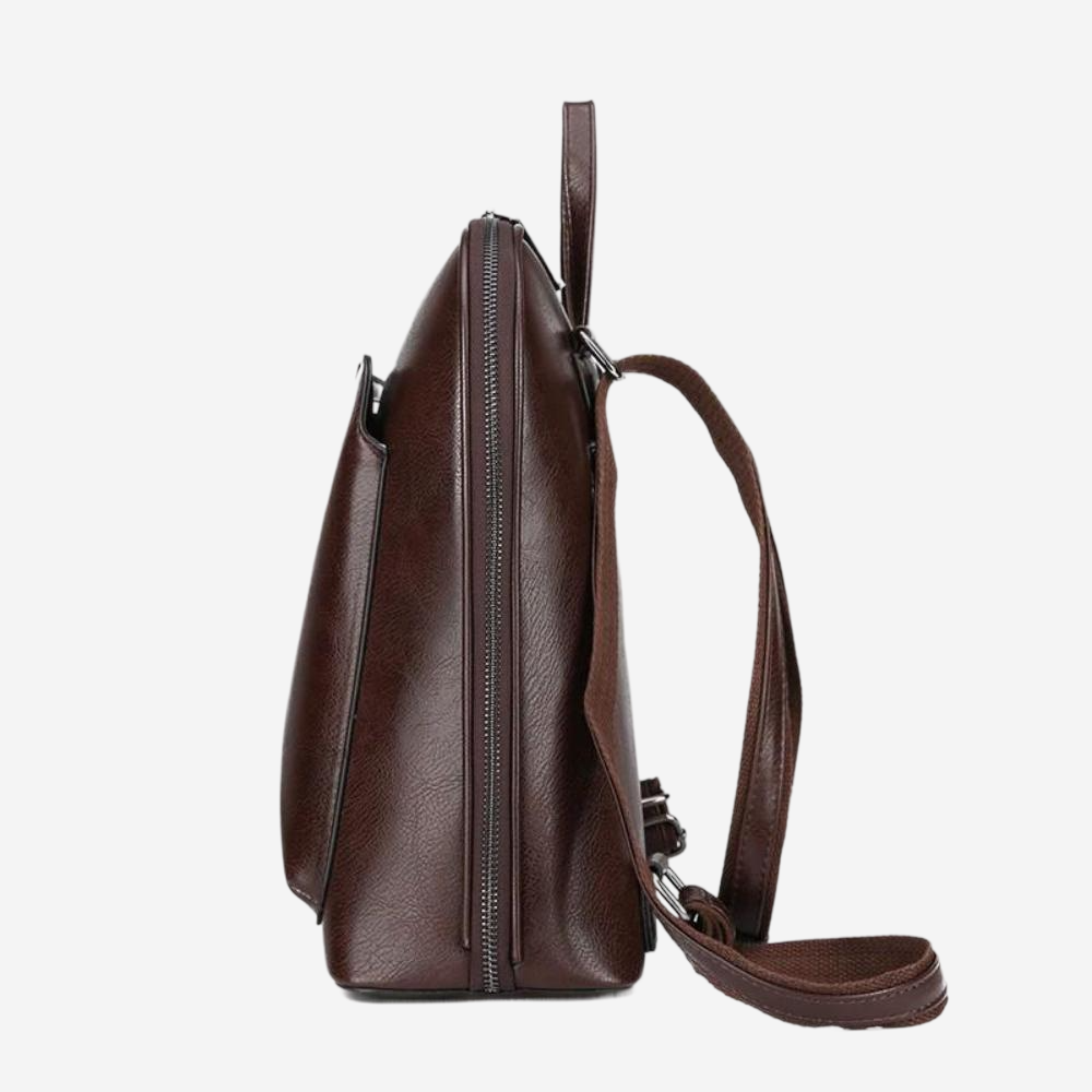 A brown leather backpack with a zipper closure and a strap.