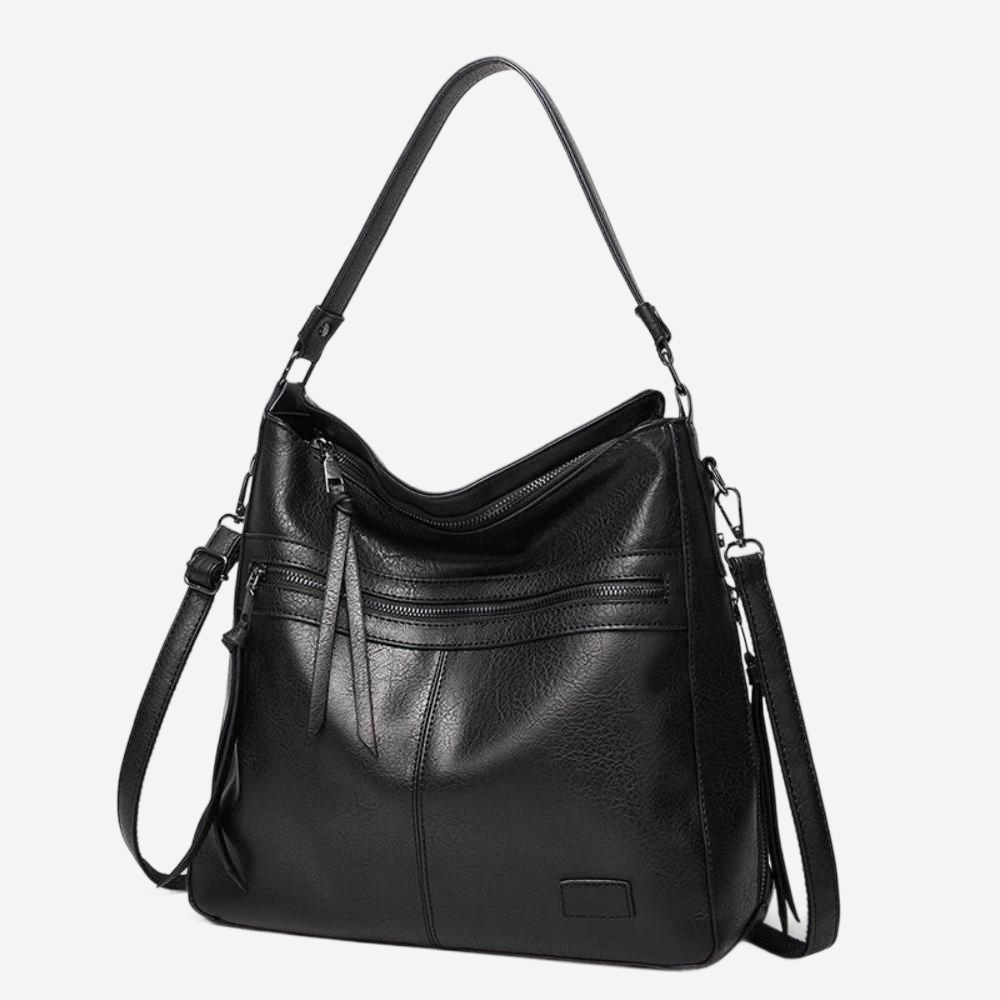 A black leather crossbody bag with multiple pockets and a curved shoulder strap.
