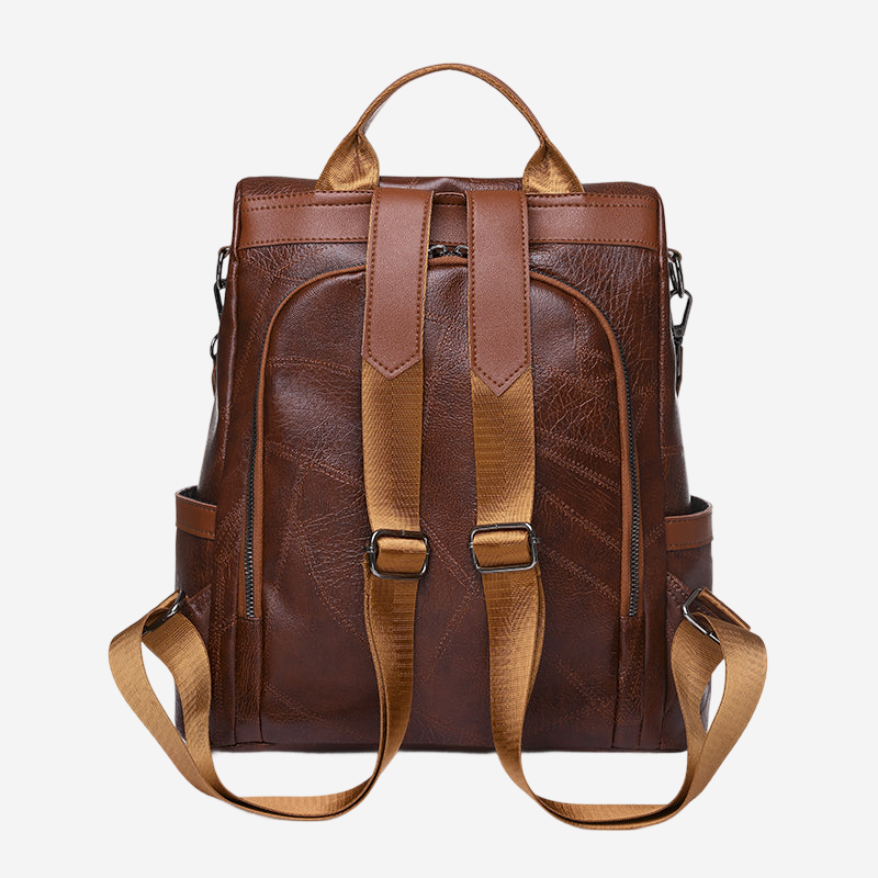 A brown leather backpack with multiple pockets and straps.