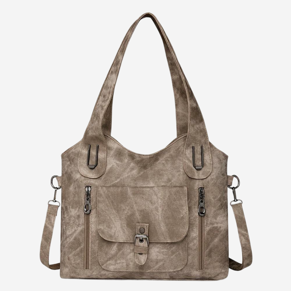 A tan leather shoulder bag with multiple zippers and a front pocket.
