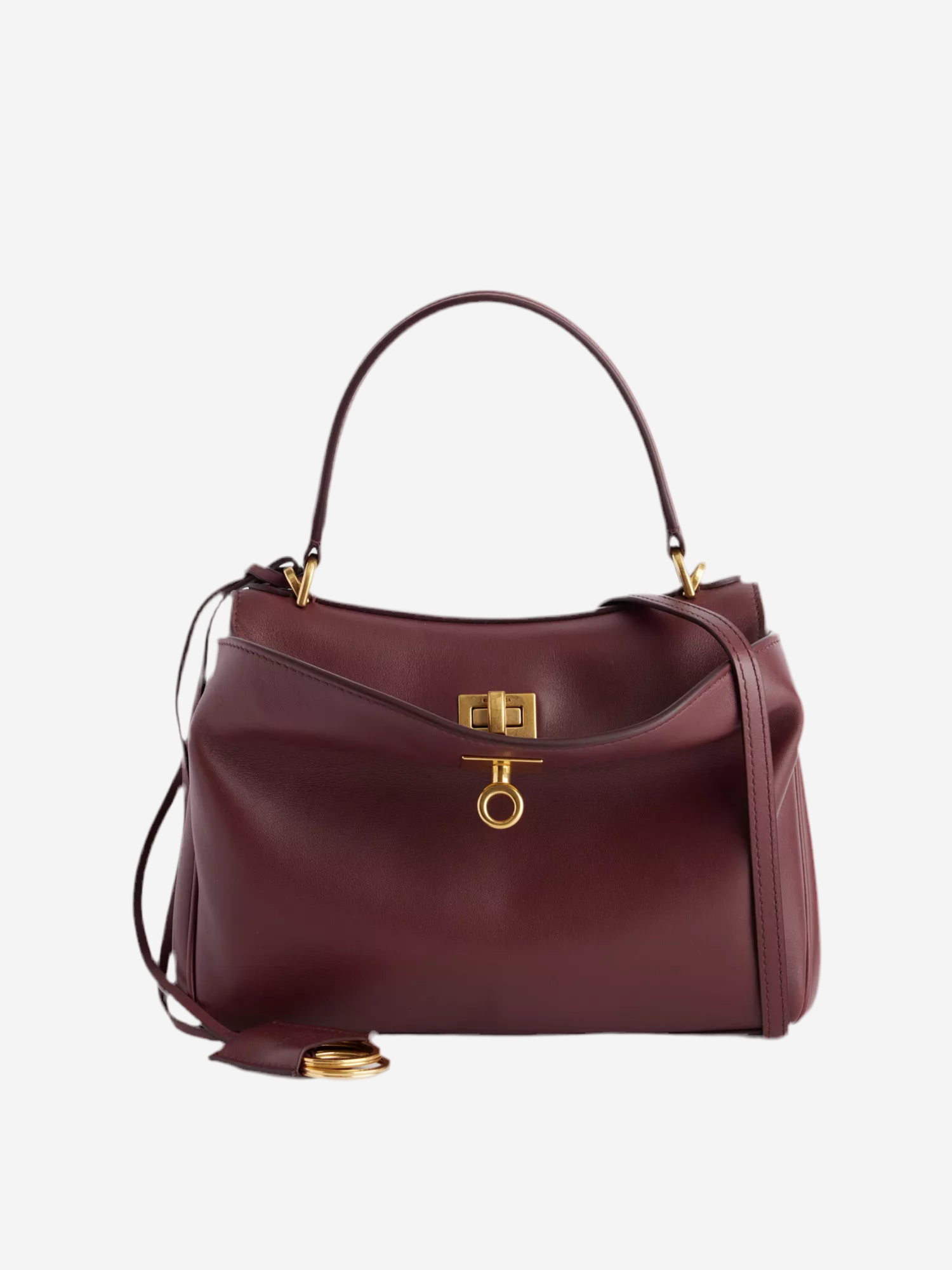 A burgundy leather handbag with a gold lock detail and a gold-tone metal clasp.
