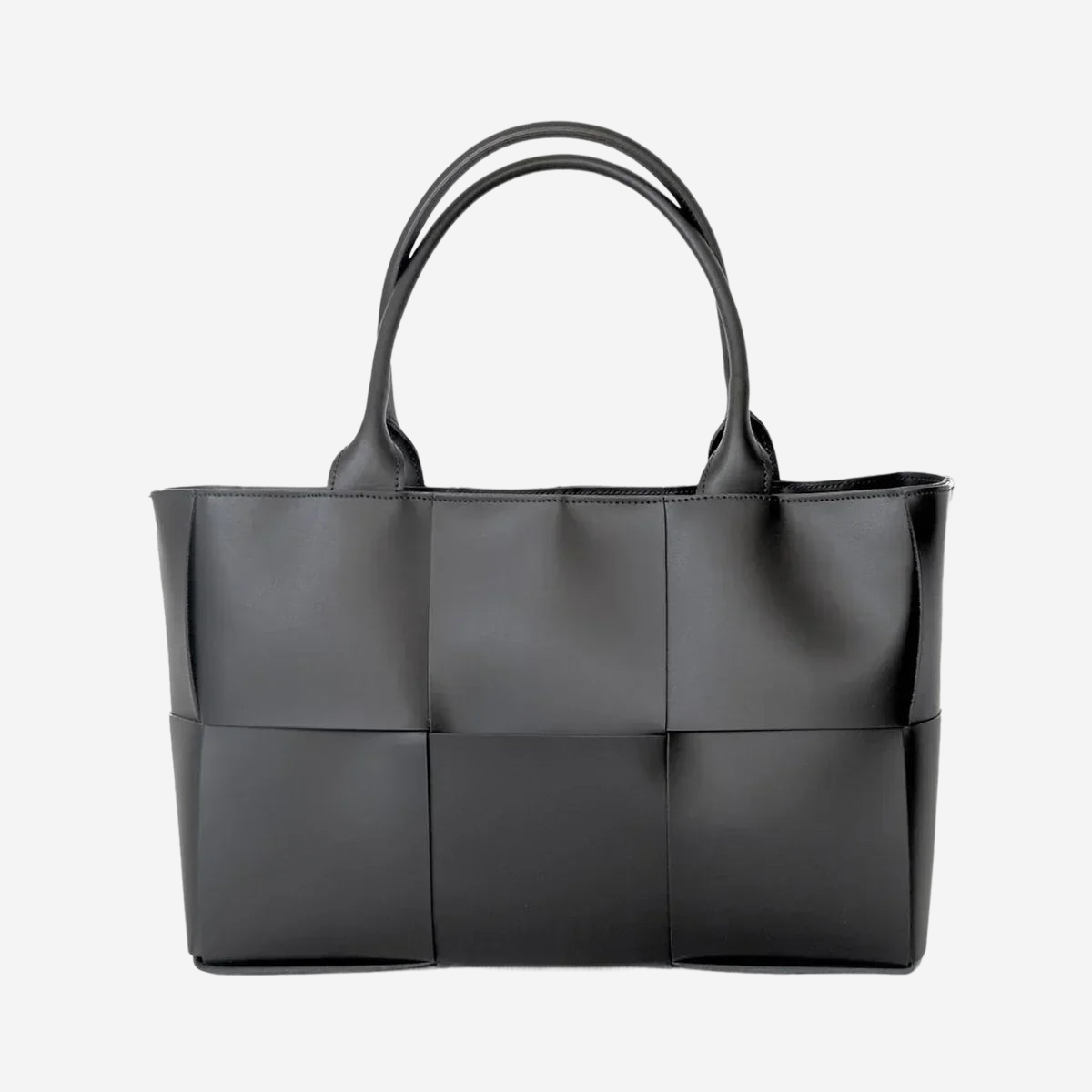 A black leather tote bag with a distinctive woven pattern.
