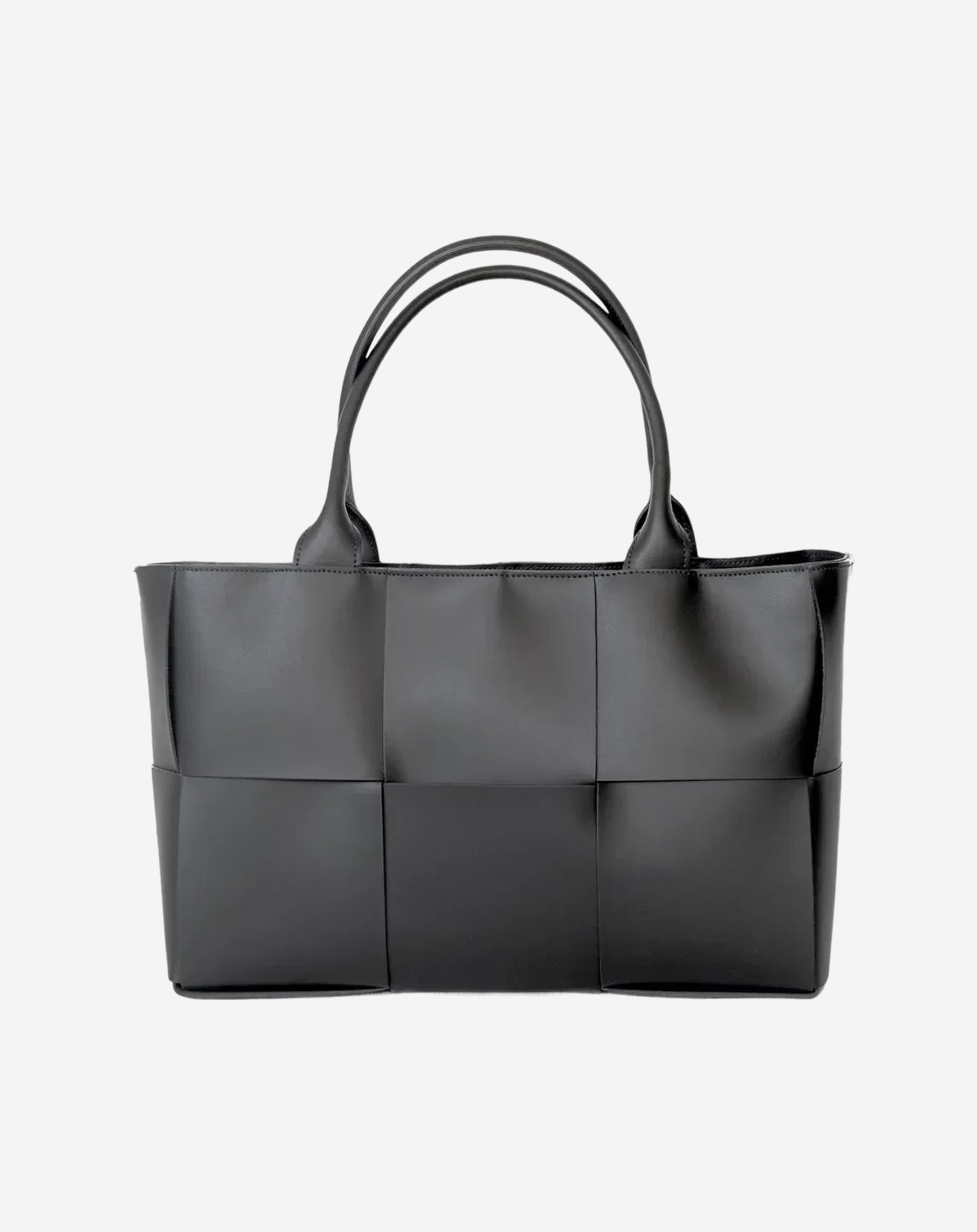 A black leather tote bag with a distinctive woven pattern.