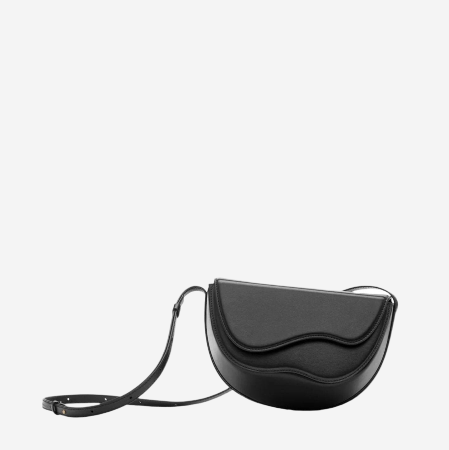 A black leather handbag with a curved shape and a strap.