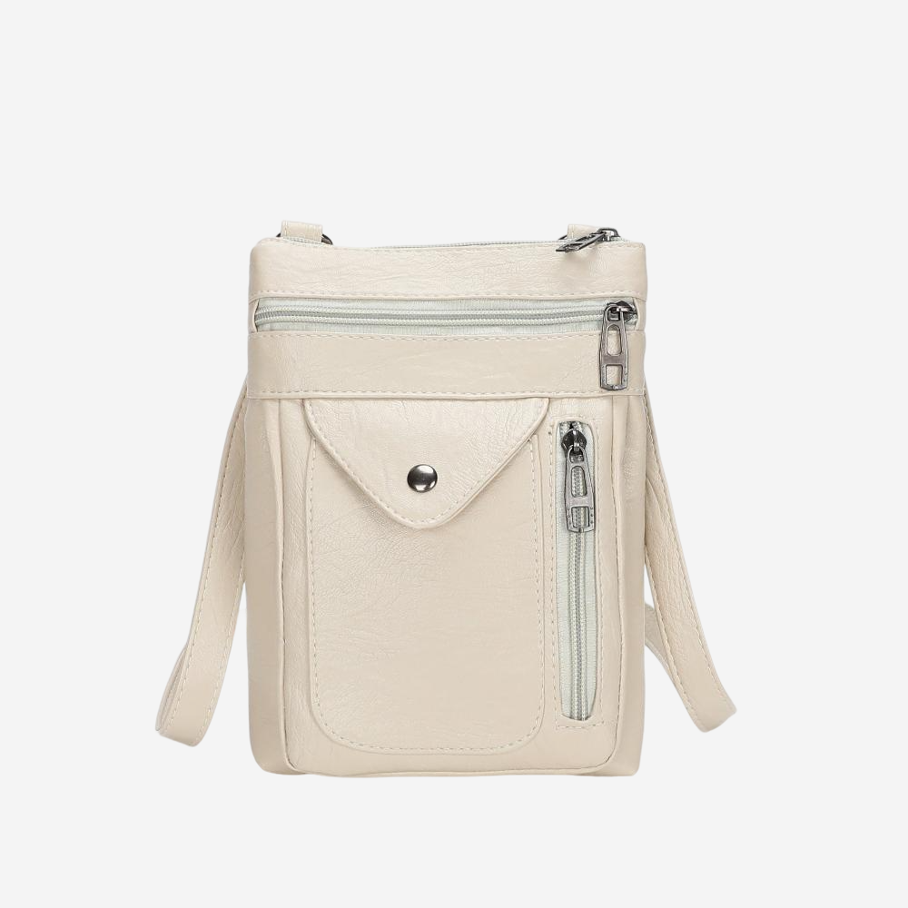 A beige crossbody bag with multiple zippers and pockets.