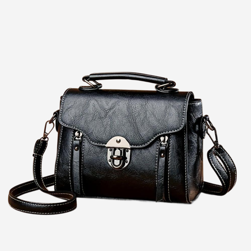 A black leather crossbody bag with a metal clasp and handle.