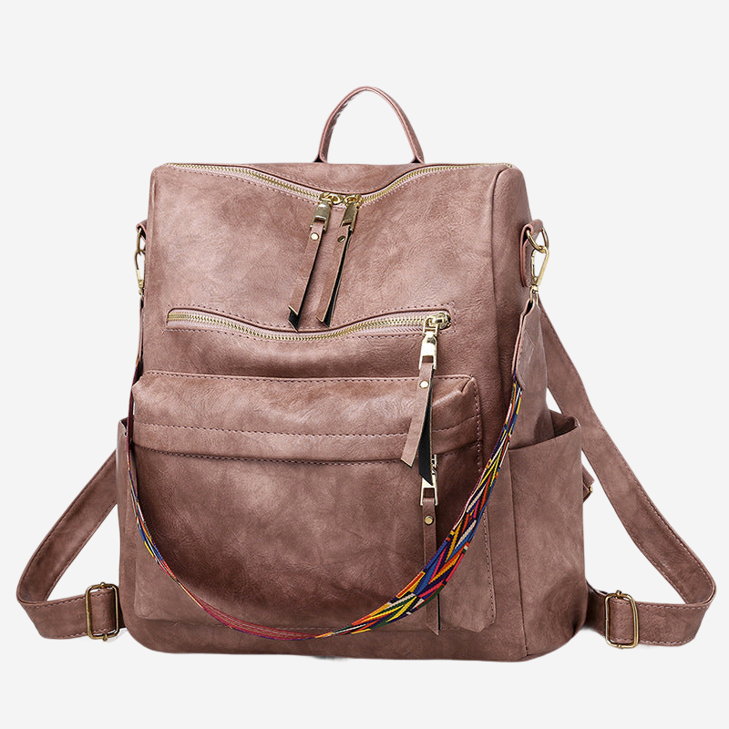 A brown leather backpack with multiple pockets and zippers, featuring a colorful strap.
