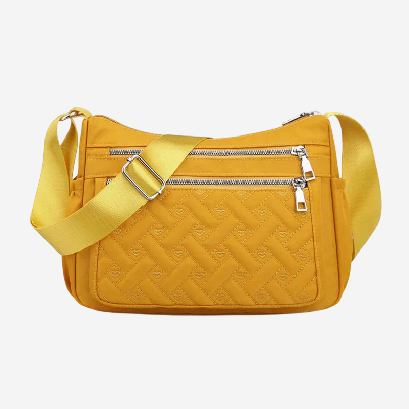 A yellow crossbody bag with a quilted pattern and a yellow strap.