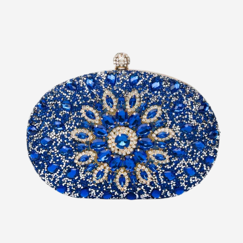 A blue clutch purse adorned with a sparkling design of blue and gold gemstones.