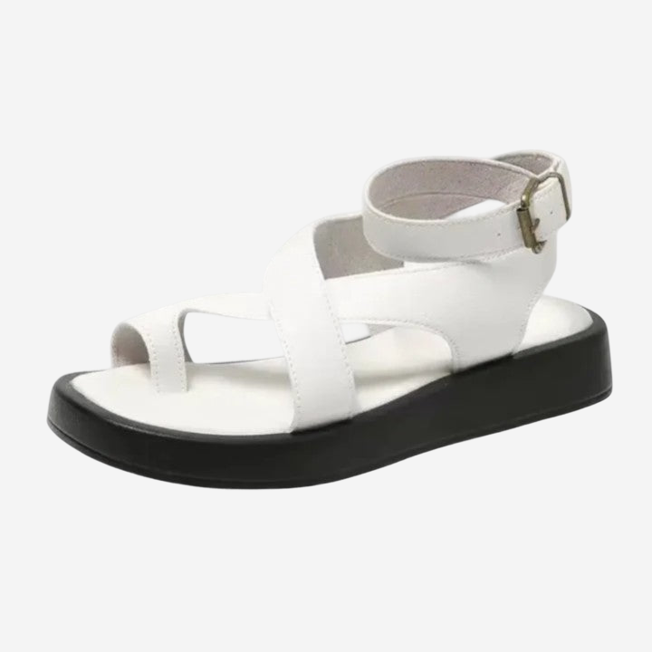 A white, strappy sandal with a black sole and strap.