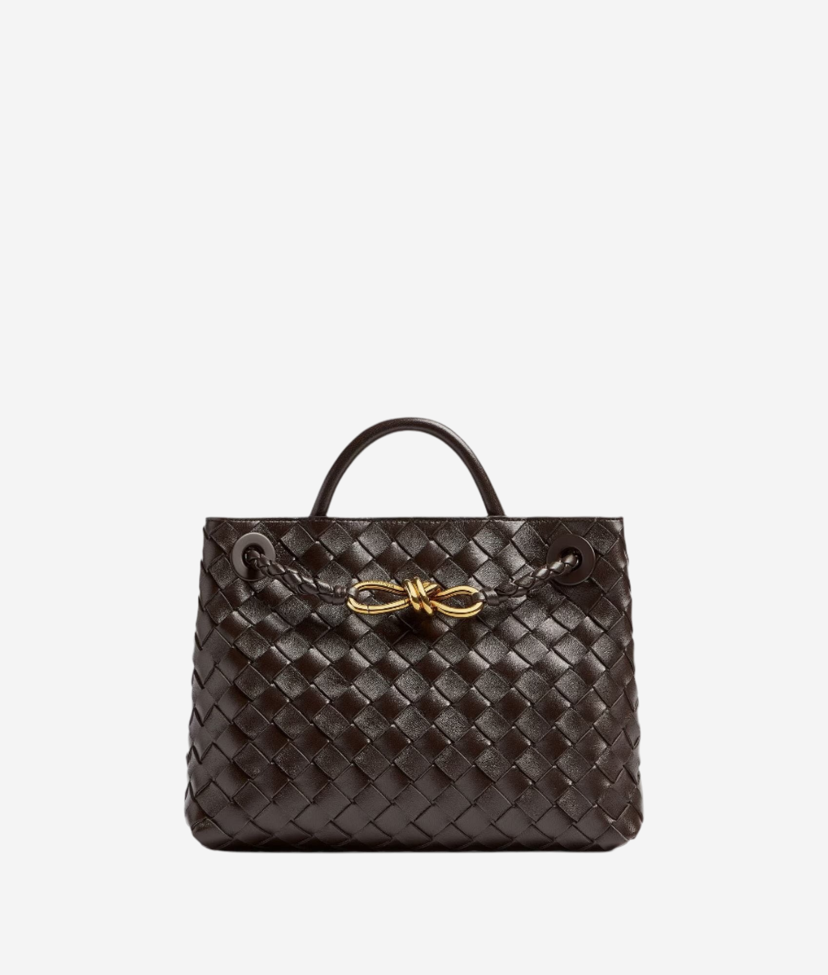 A brown woven handbag with a gold clasp and handle.