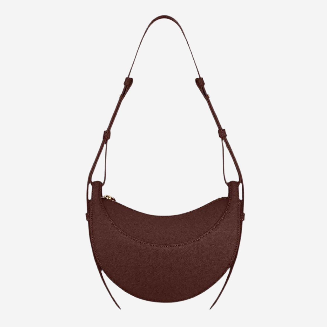A brown leather handbag with a curved shape and a strap.