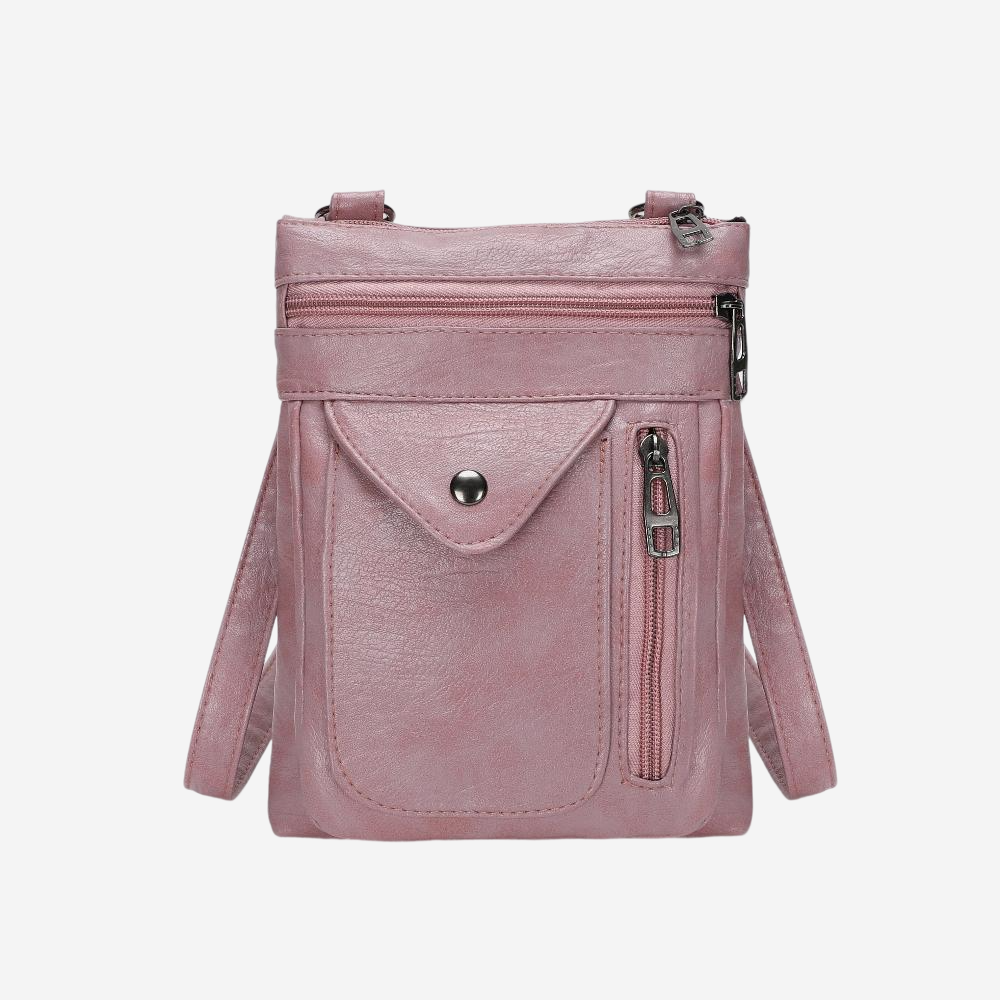 A pink leather crossbody bag with multiple pockets and zippers.