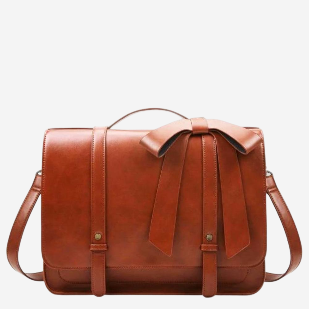 A brown leather handbag with a bow detail on the front.